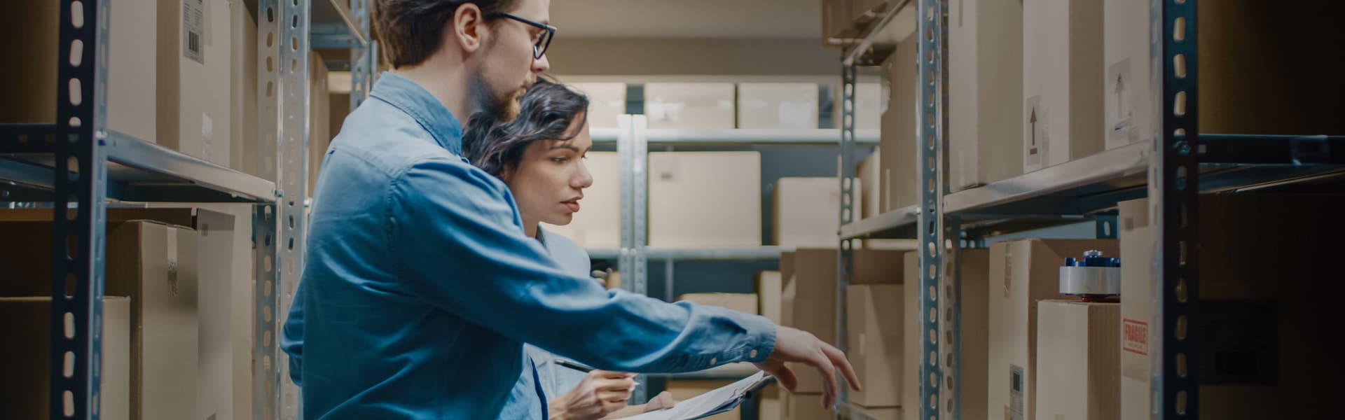 Warehouse workers organizing inventory
